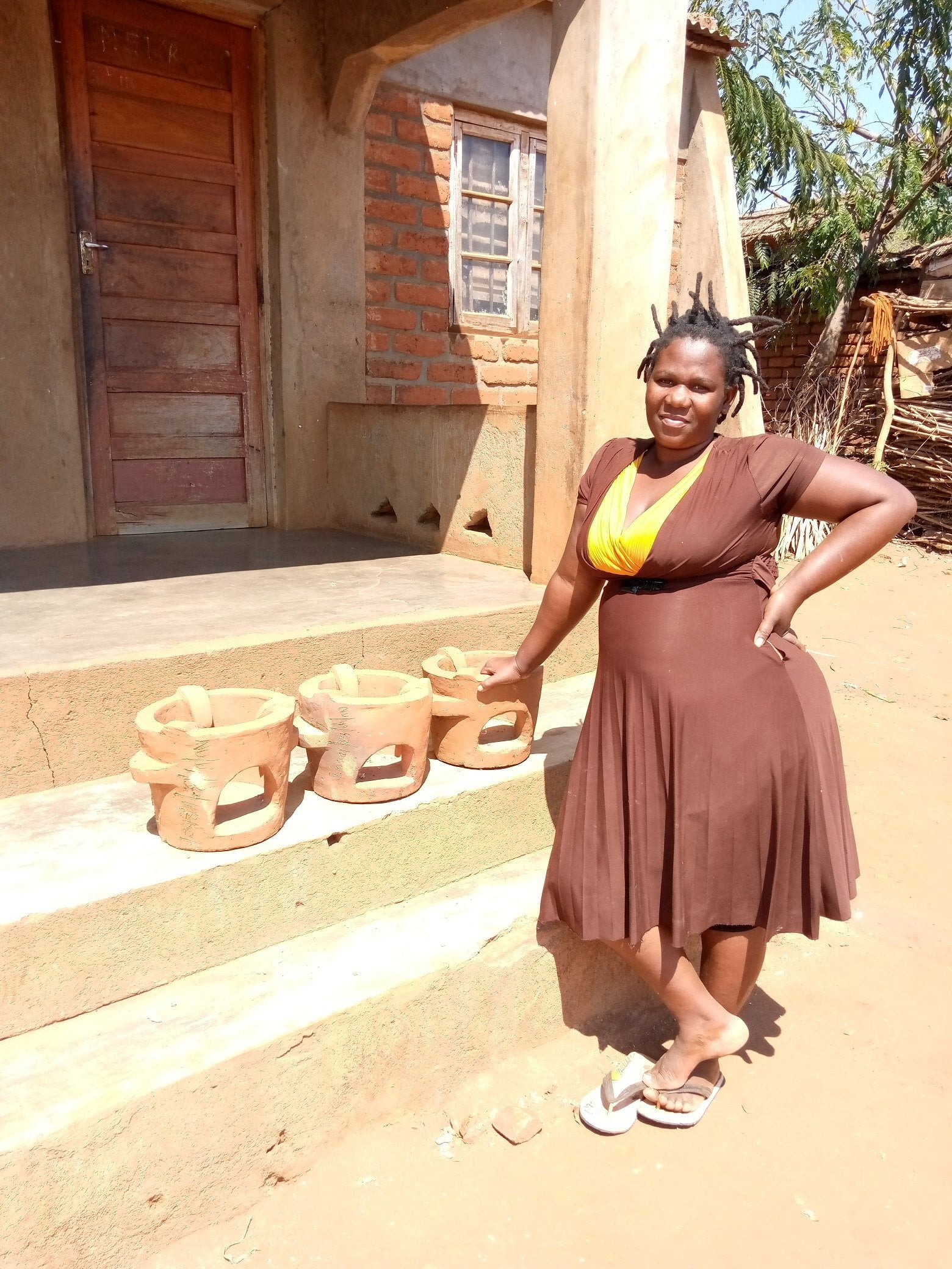 Woman standing by Chitetezo Mbaula