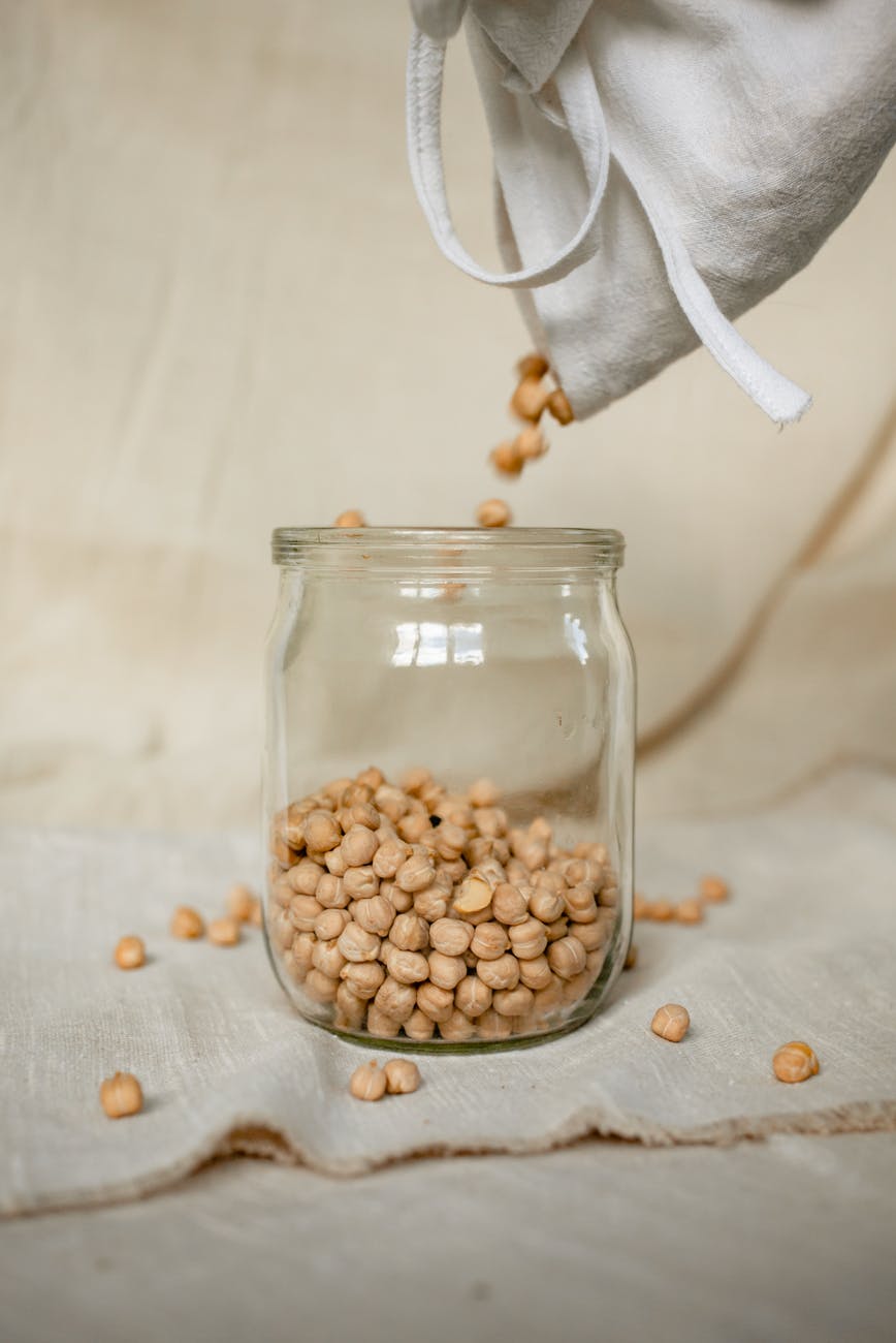 brown beans in clear glass jar
