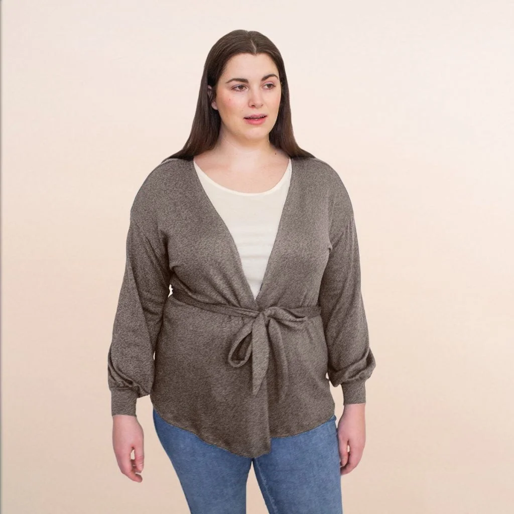 woman in plus sized cardigan and jeans