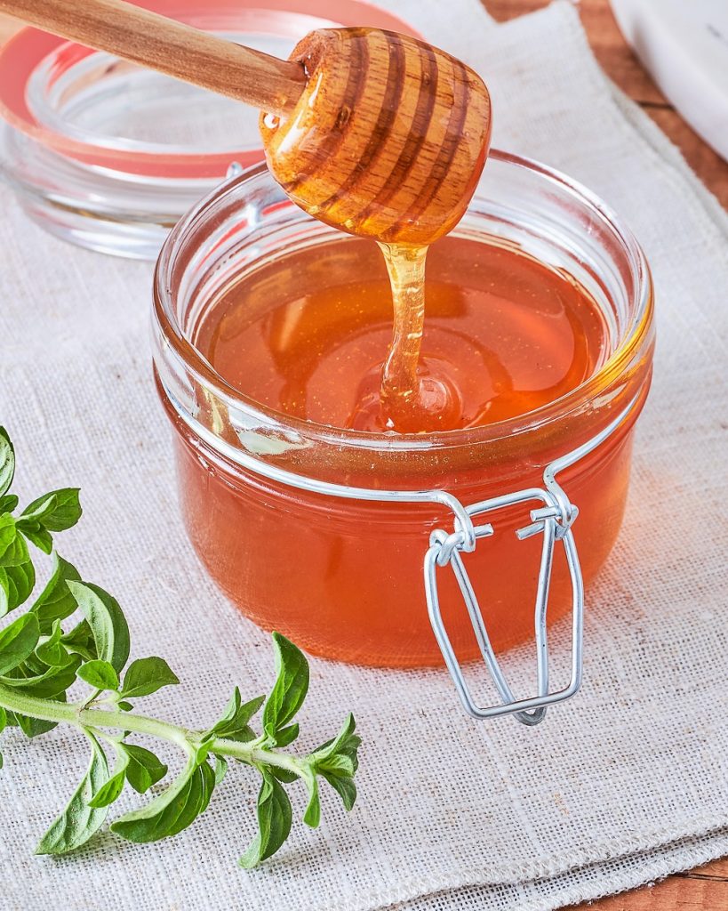 Skin Care Home Remedies: honey dipper in a jar of honey