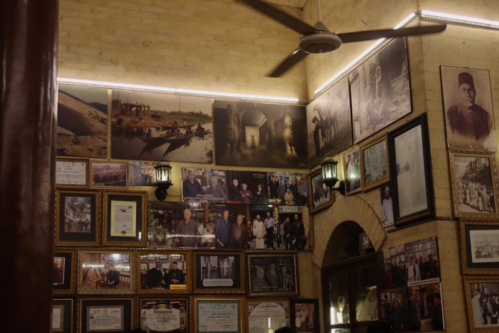 Visiting Iraq: photos and portraits lining the walls in a cafe