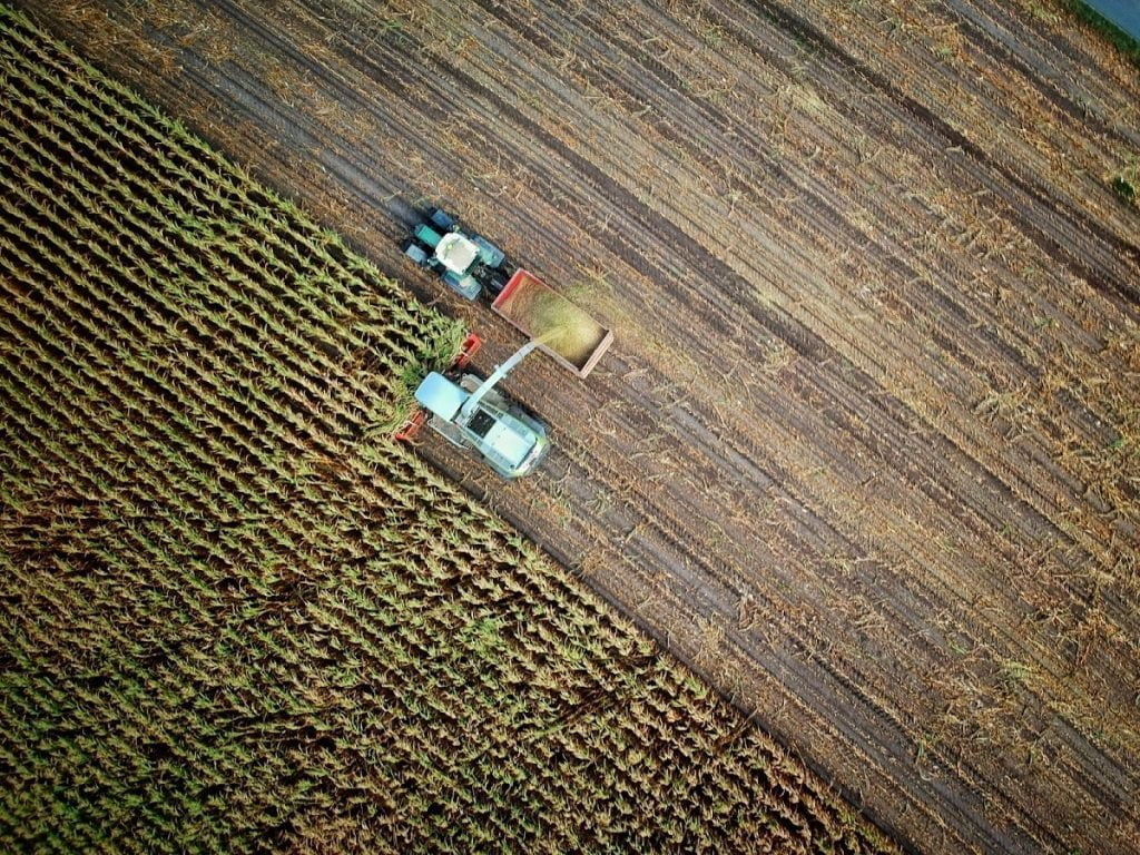 Ethics in Food and Agriculture: A farm harvester seen from above