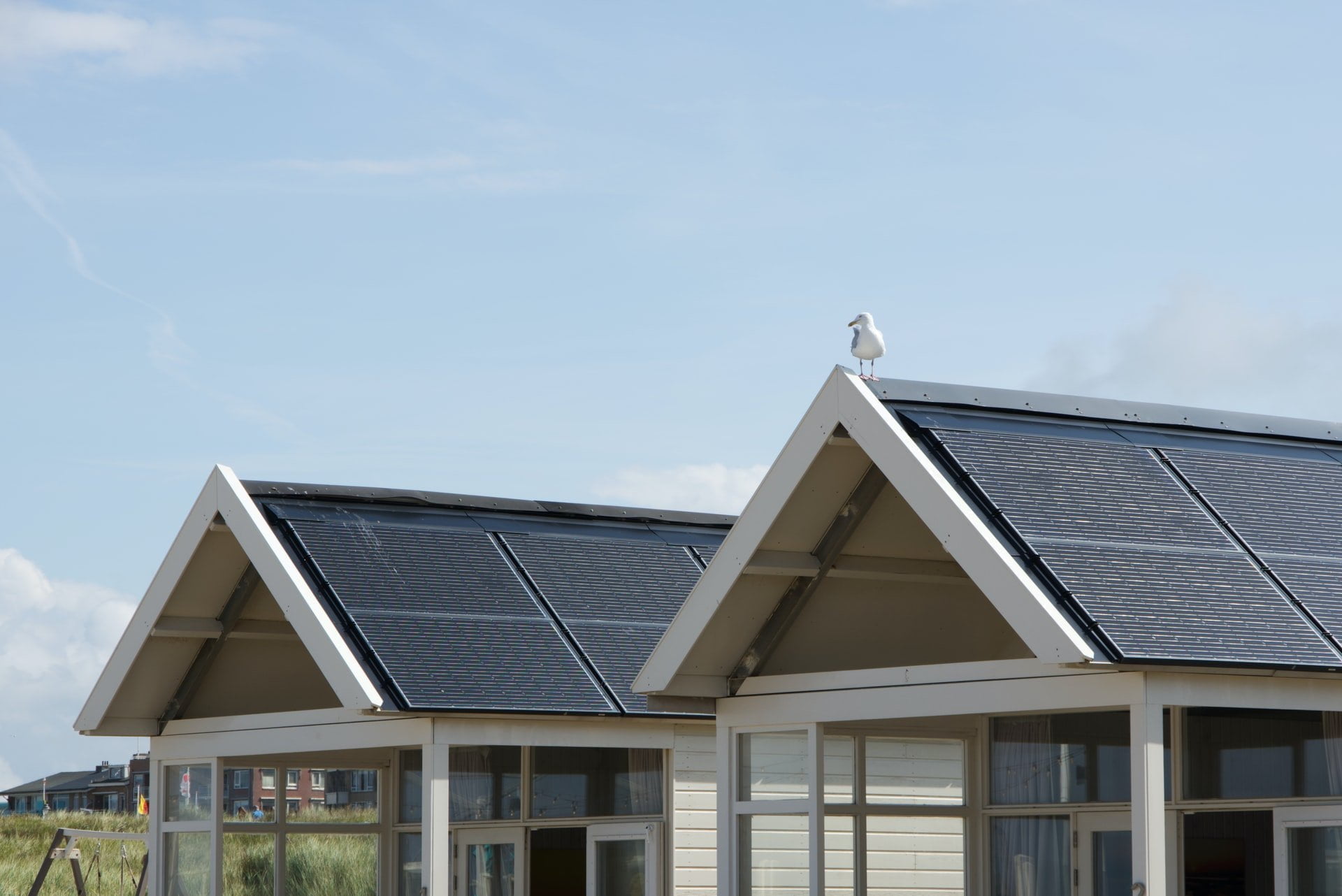 Eco-Friendly Rental Property: Rooftop solar panels on two houses