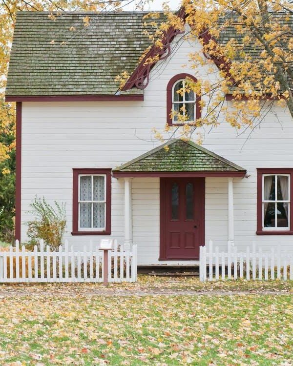 Sustainable Decor: A small white house in autumn