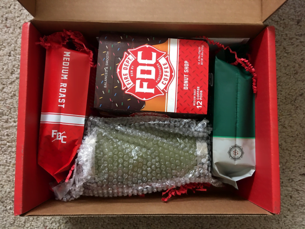 FDC box opened to reveal coffee bags and related goodies