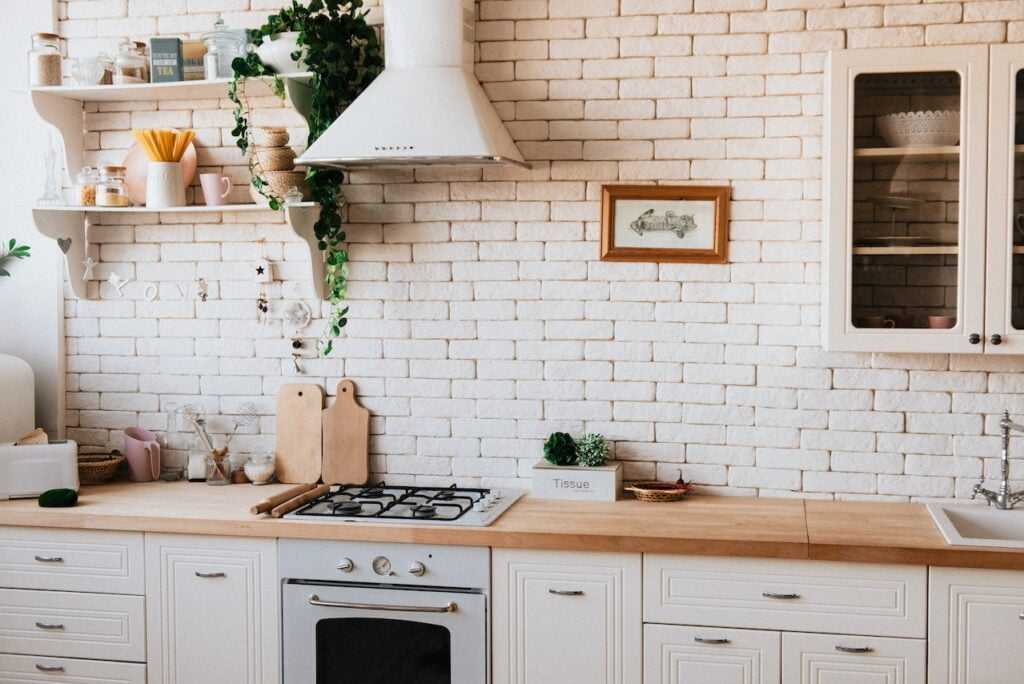 Eco-Friendly Kitchen with timber, painted brick, and indoor plants