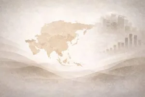 Asia map graphic with faint charts and a city skyline in the background.
