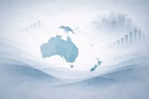 Oceania map graphic with Australia and New Zealand, with faint charts and city skyline in the background.